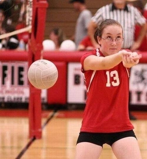 Playing volleyball. Keep your eye on the ball kid!!!