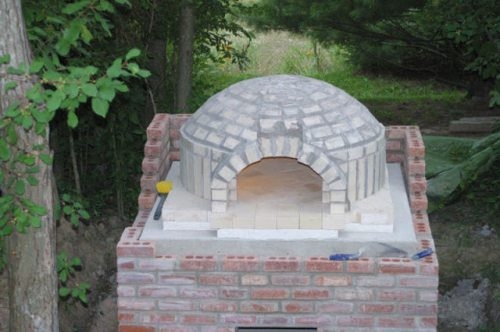 Man builds his own pizza oven in the yard. Result? Incredulous!