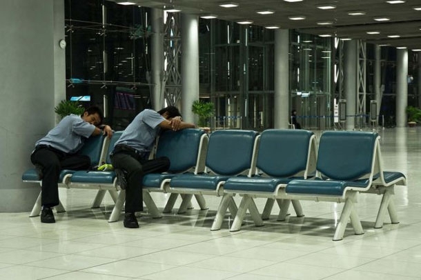 Awkward Sleeping Positions Of People At Airports