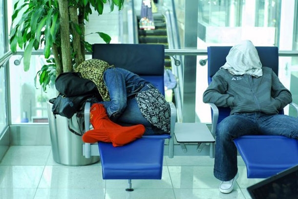 Awkward Sleeping Positions Of People At Airports