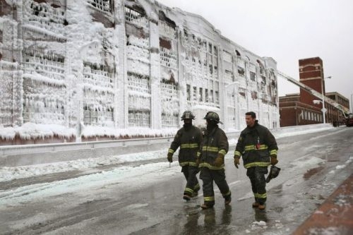 Chicago Firemen put out fire in the icy cold