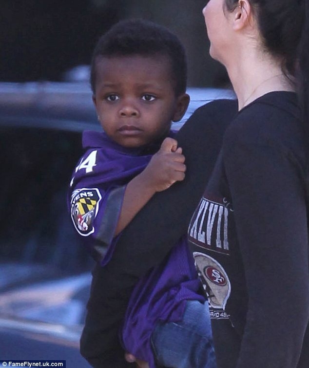 Sandra Bullock's son Louis sports Michael Oher jersey 