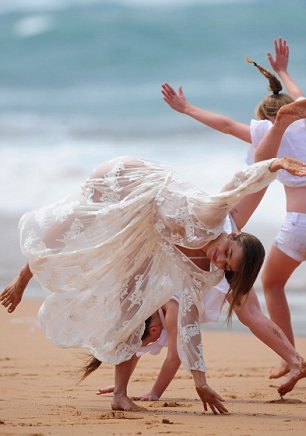 Miranda Kerr shows off her underwear in see-through dress