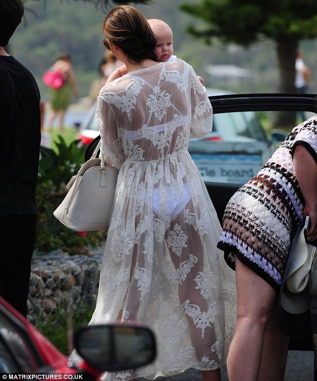 Miranda Kerr shows off her underwear in see-through dress