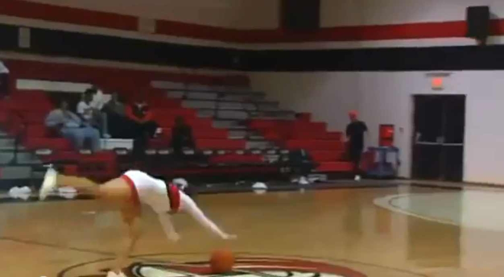 Cheerleader Hits Amazing Basketball Trick Shot