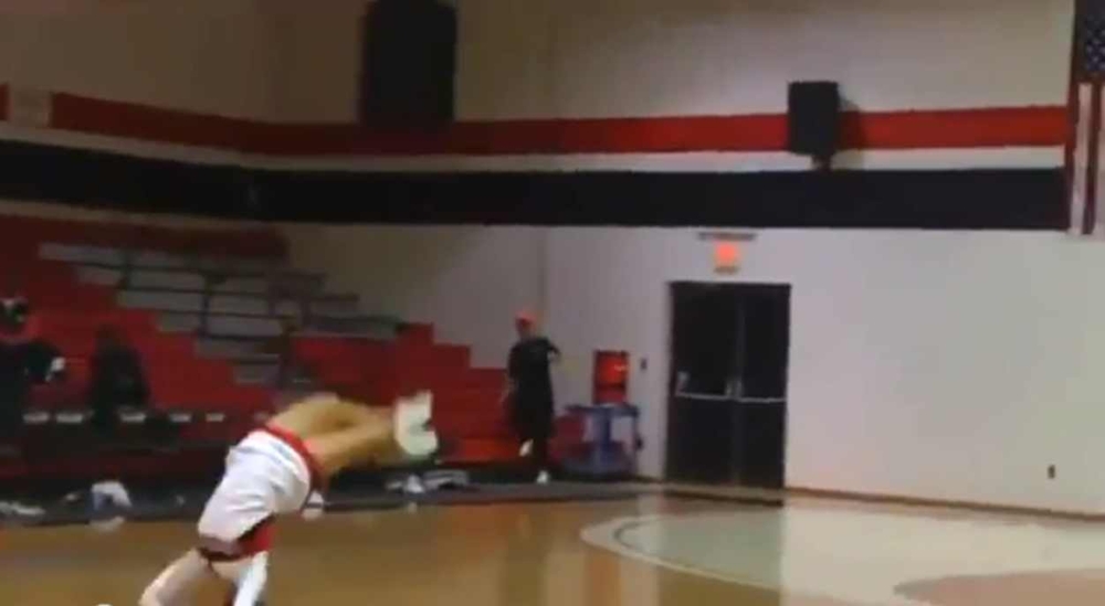 Cheerleader Hits Amazing Basketball Trick Shot