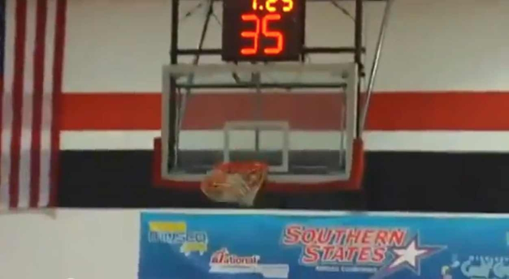 Cheerleader Hits Amazing Basketball Trick Shot