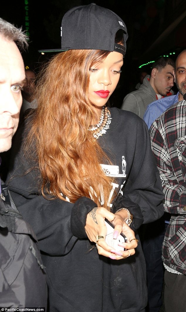 Rihanna heads to a club in just a jumper