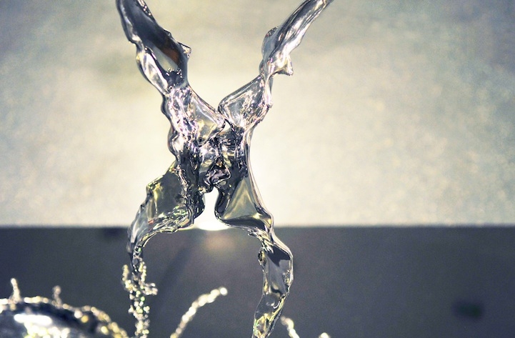 Surreal Sculptures of Human Faces Frozen in Liquid