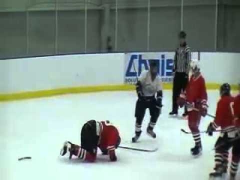 Hockey Player Breaks Stick On Opponent 