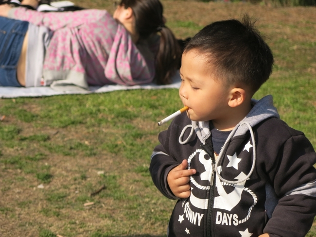 Kid Smokes Cigarette 