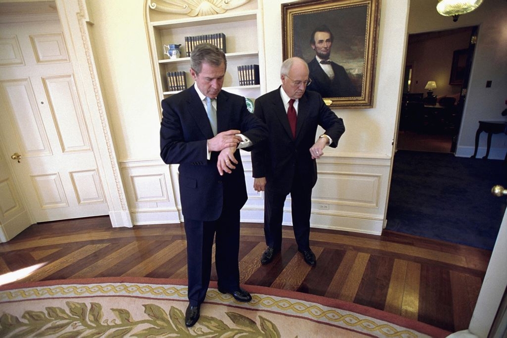 George W. Bush and Dick Cheney Check the time