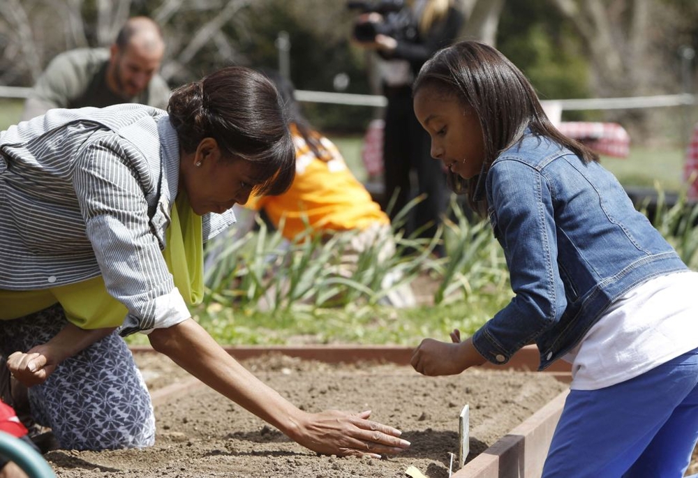 Michelle Obama Planting veggies 