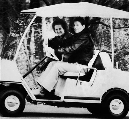 Thatcher Riding in golf cart 