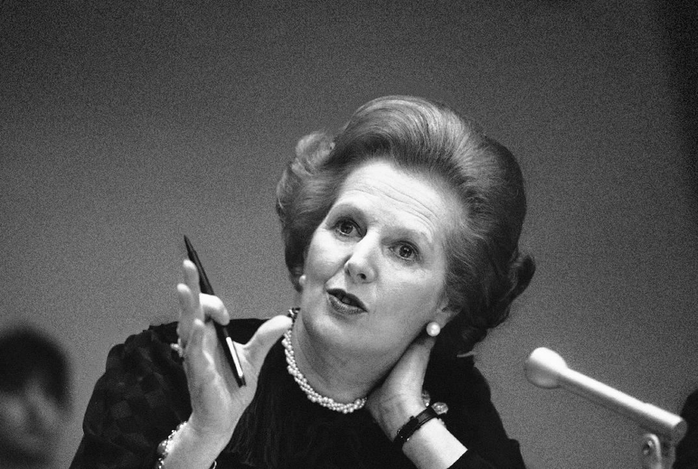 Thatcher Gesturing at a conference 