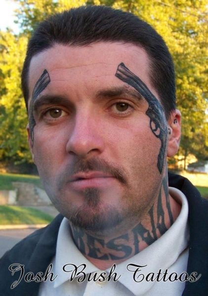 Revolver tattooed on the face