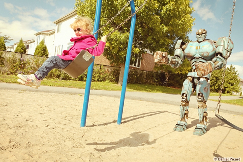 Robot pushes girl on swing 