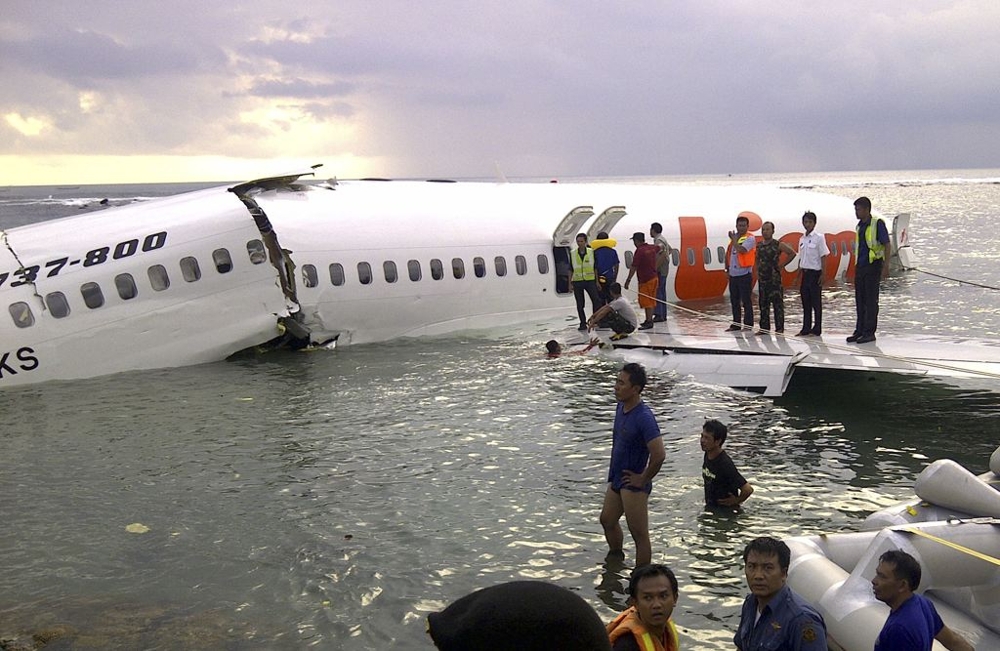 Rescuers look through the plane 