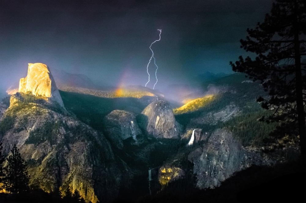 A bolt of lightning cracking through a rainbow