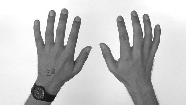Mind-Boggling Video Repeatedly Transitions Between Hands & Photos of Hands
