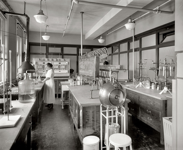 Mrs. M.M. Brooke, a chemist in her laboratory at the Corby Baking Company, c. 1922