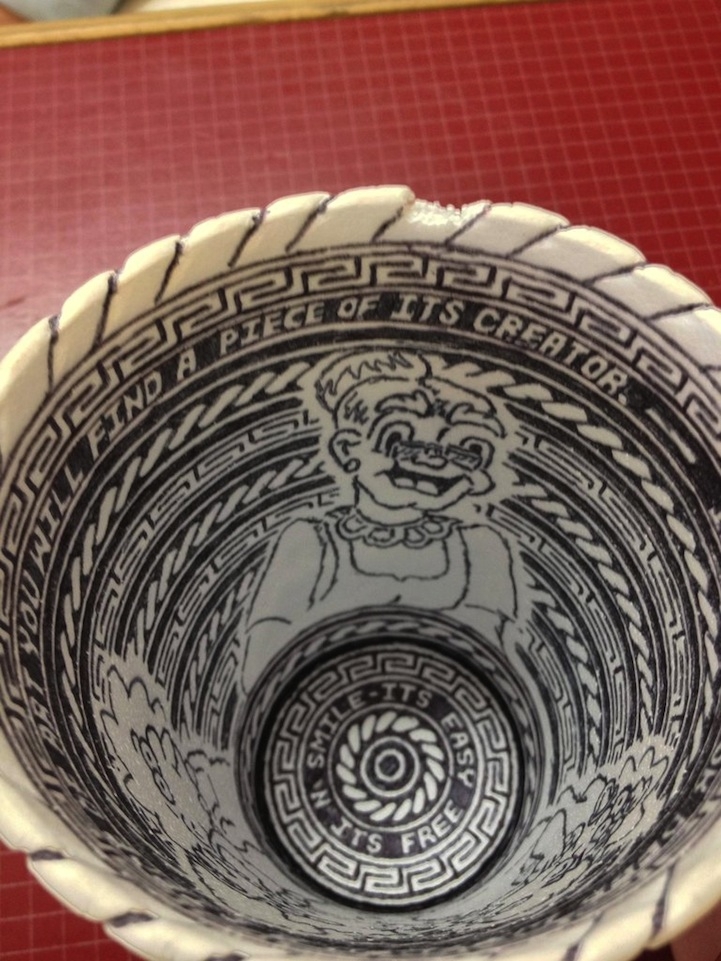 Incredibly detailed pen drawings on styrofoam cup 