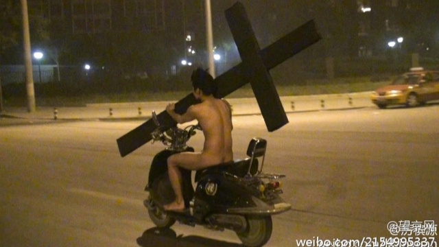 Just A Naked Chinese Dude With A Cross, Nothing Outrageous Here.