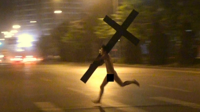 Just A Naked Chinese Dude With A Cross, Nothing Outrageous Here.