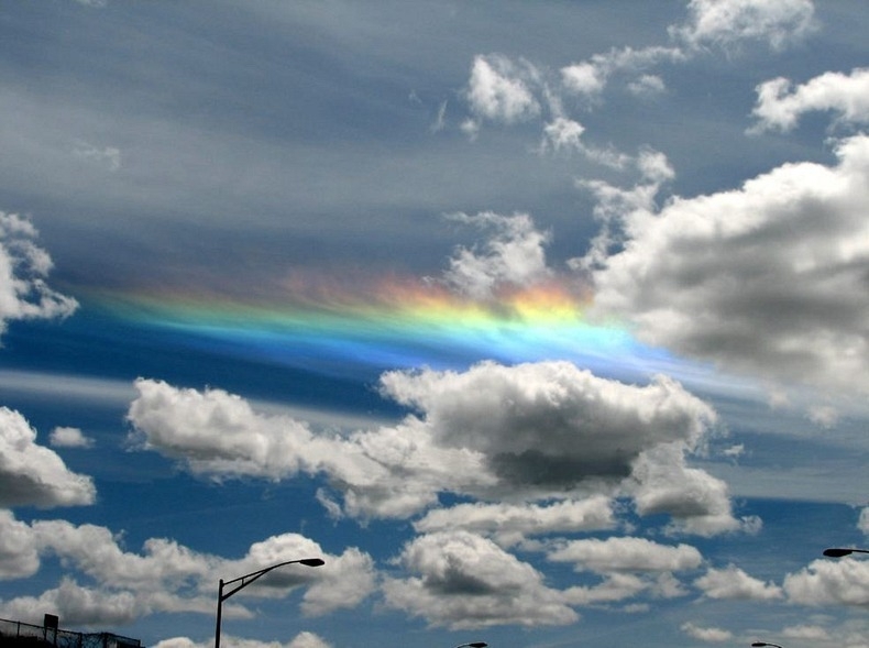 Circumhorizon arcs are often seen between lower obscuring clouds. This one was seen in Redding, CA in June 2004.