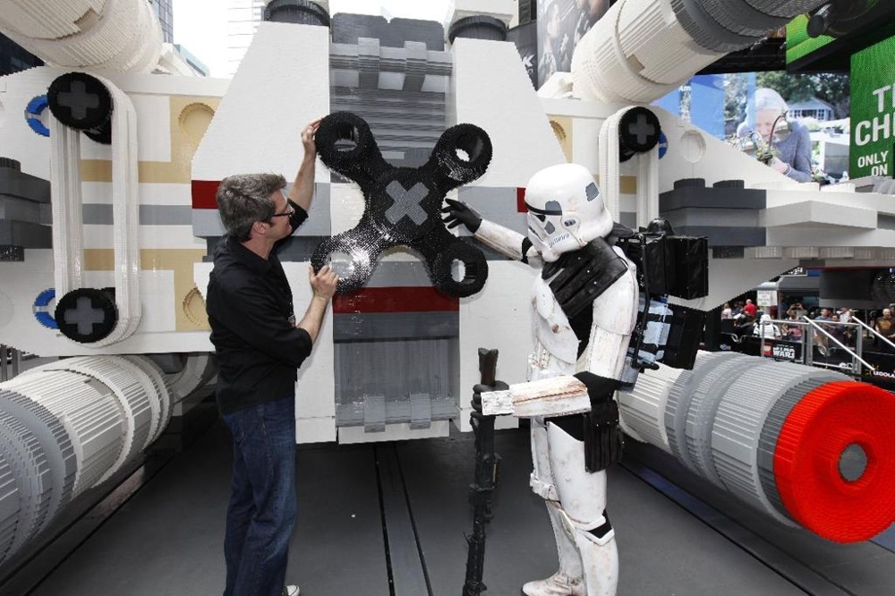 LEGO Master Builder Erik Varszegi and members of the 501st inspect the thrusters