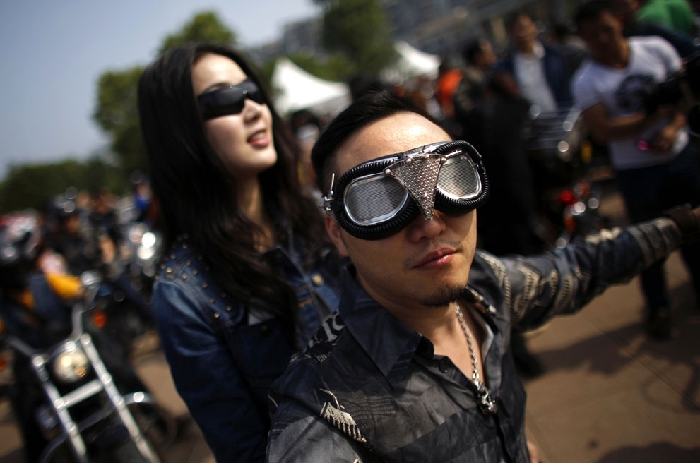 A couple rides in the rally in Qian Dao Lake, on May 11, 2013.