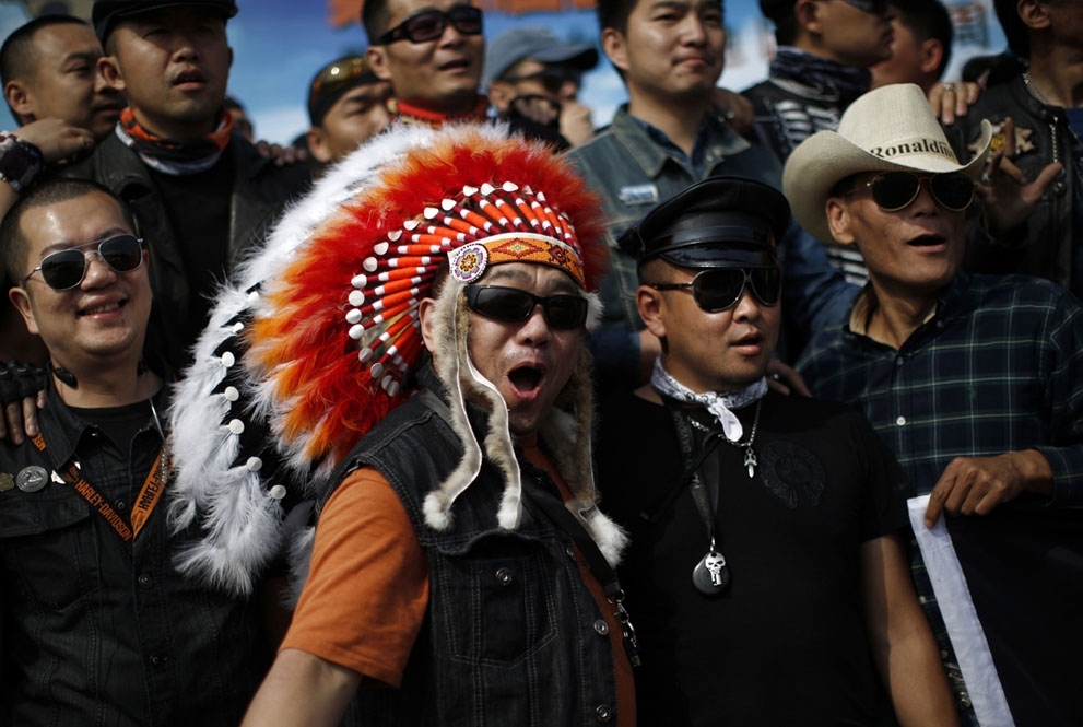 Harley Davidson riders pose for a group picture in Zhejiang Province, on May 11, 2013.