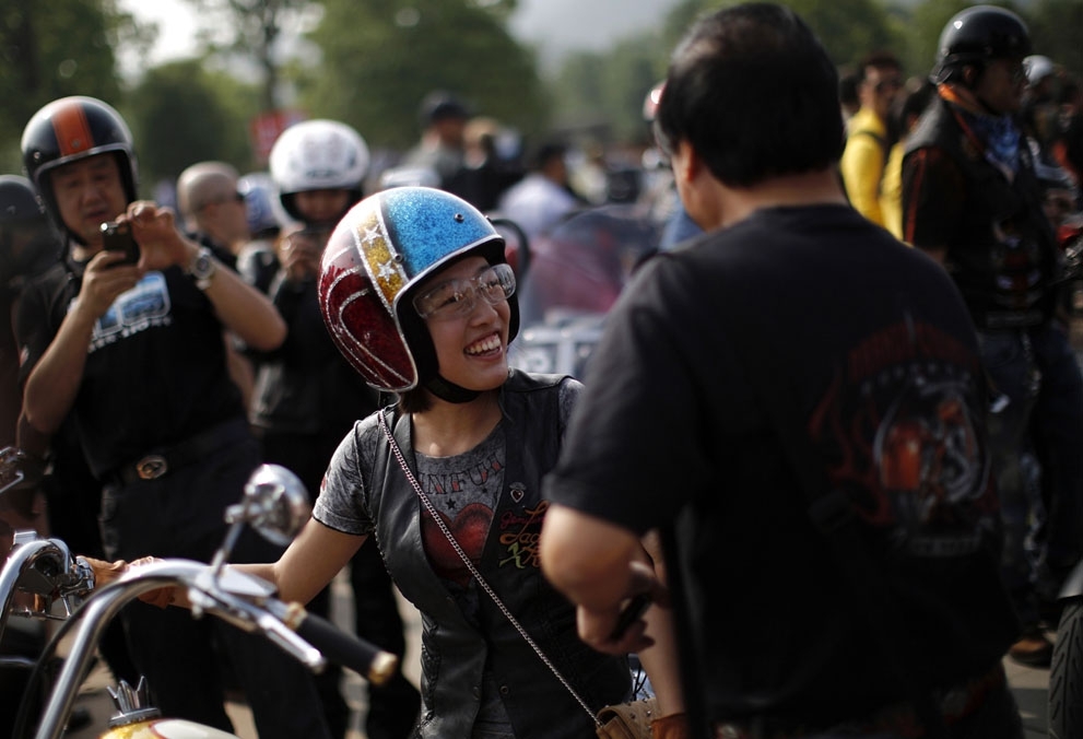A woman attends the annual Harley Davidson National Rally in Qian Dao Lake, China, on May 11, 2013.
