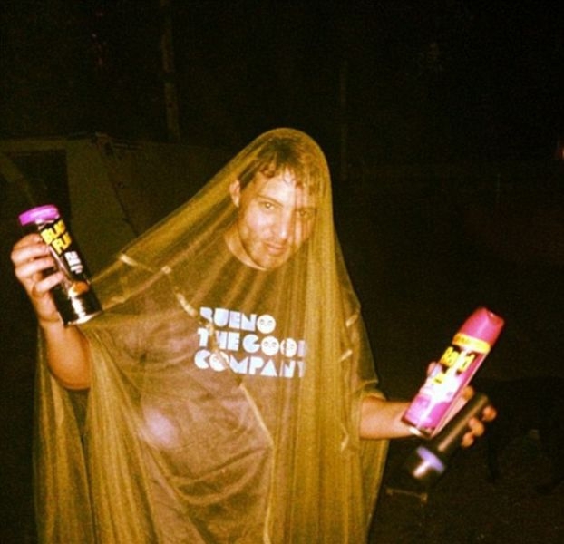 I Need More Bug Spray: One man holds aloft his weapons against the bug infestation last night in New Orleans