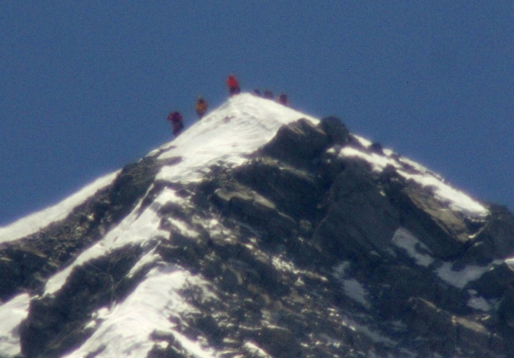 Climbers And Yuichiro Miura stand on the summit of Mount Everest on Thursday, May 23, 2013