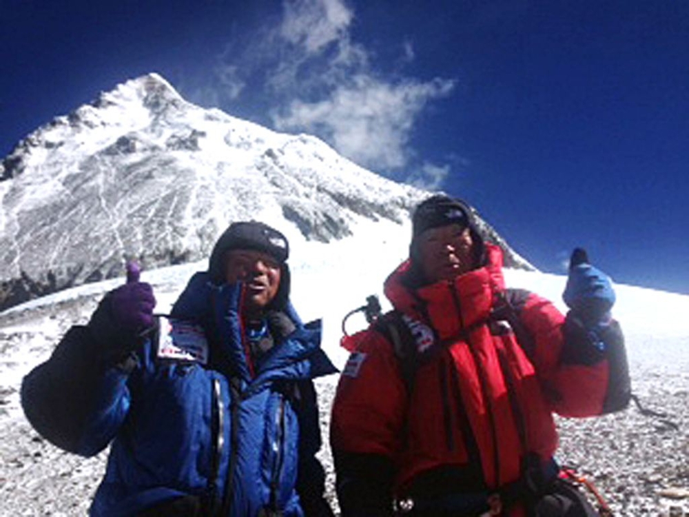 80-year-old Japanese extreme climber Yuichiro Miura, right, and his son