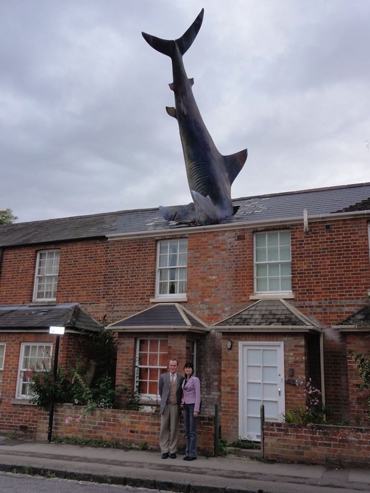 Surreal Shark Crashes Head-First Through a House