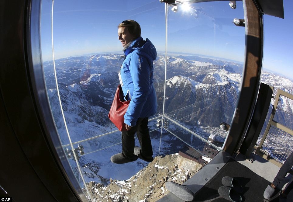 Glass cage  over the edge of 4km-high mountain in French Alps