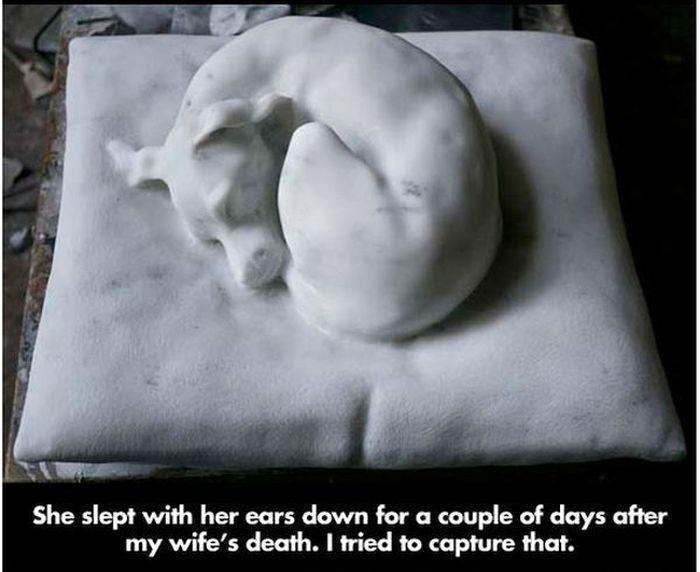 A marble sculpture of the dead wife and her dog