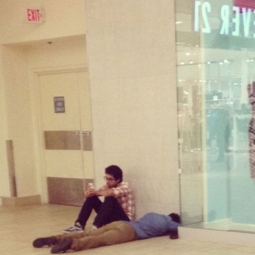 Bored men in shopping centers 