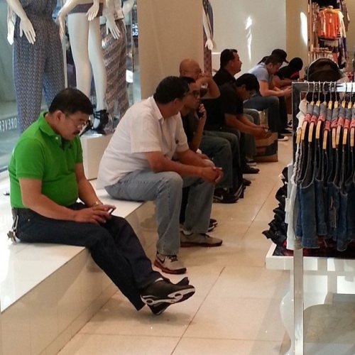 Bored men in shopping centers 