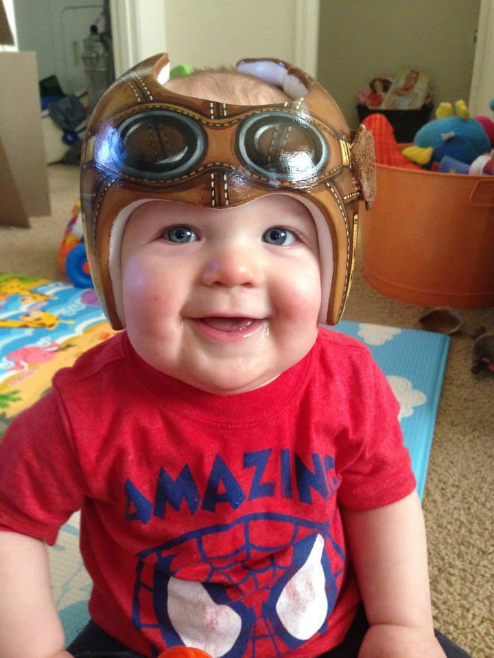 Required baby helmets become a great accessory thanks to a little art 
