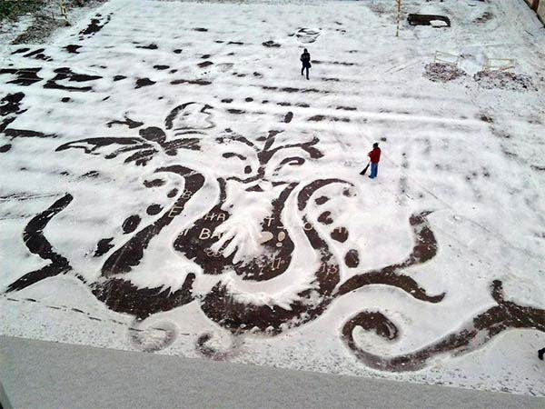 A School Groundskeeper In Russia creates large drawings in the snow