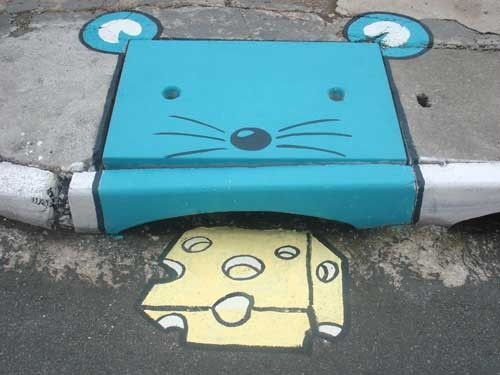 Two Artists Cover Gray Streets With Colorful Character Illustrations
