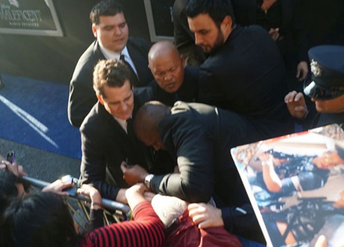 Brad Pitt Gets Hit In The Face At Maleficent Premiere