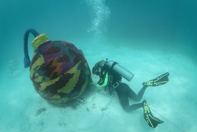 Artist Dives Underwater To Knit Cozy Sweaters For Submerged Objects
