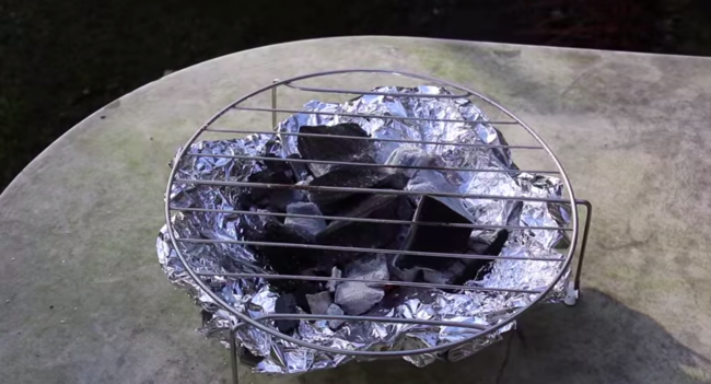 Step 5: Light the charcoal and cover with the rack.