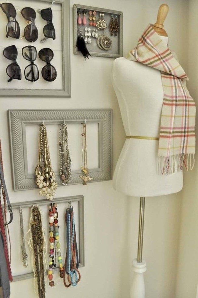 If you're going for a more elegant organizational display, put hooks on picture frames to store jewelry.