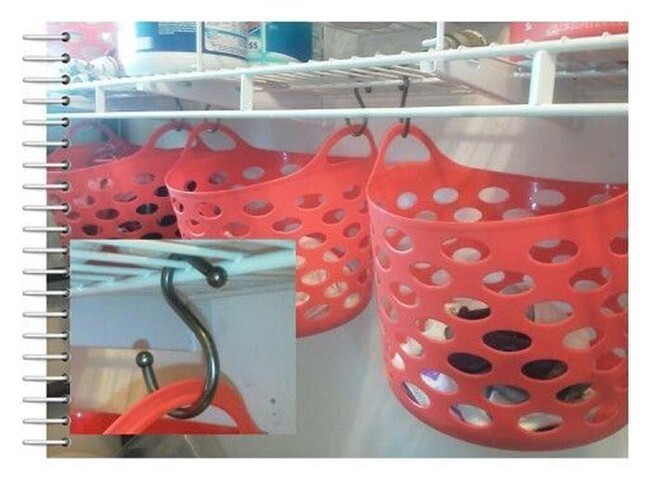 Hang plastic bins from your closet shelves for extra storage.