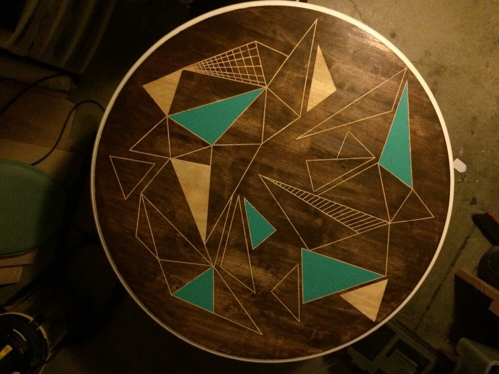 He then filled in some of the triangles with a pop of color and added a layer of polyurethane.